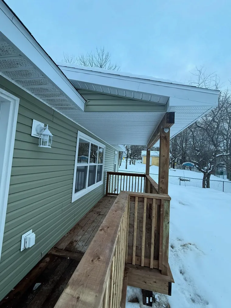 Exterior renovation with new siding and deck on a Nova Scotia home