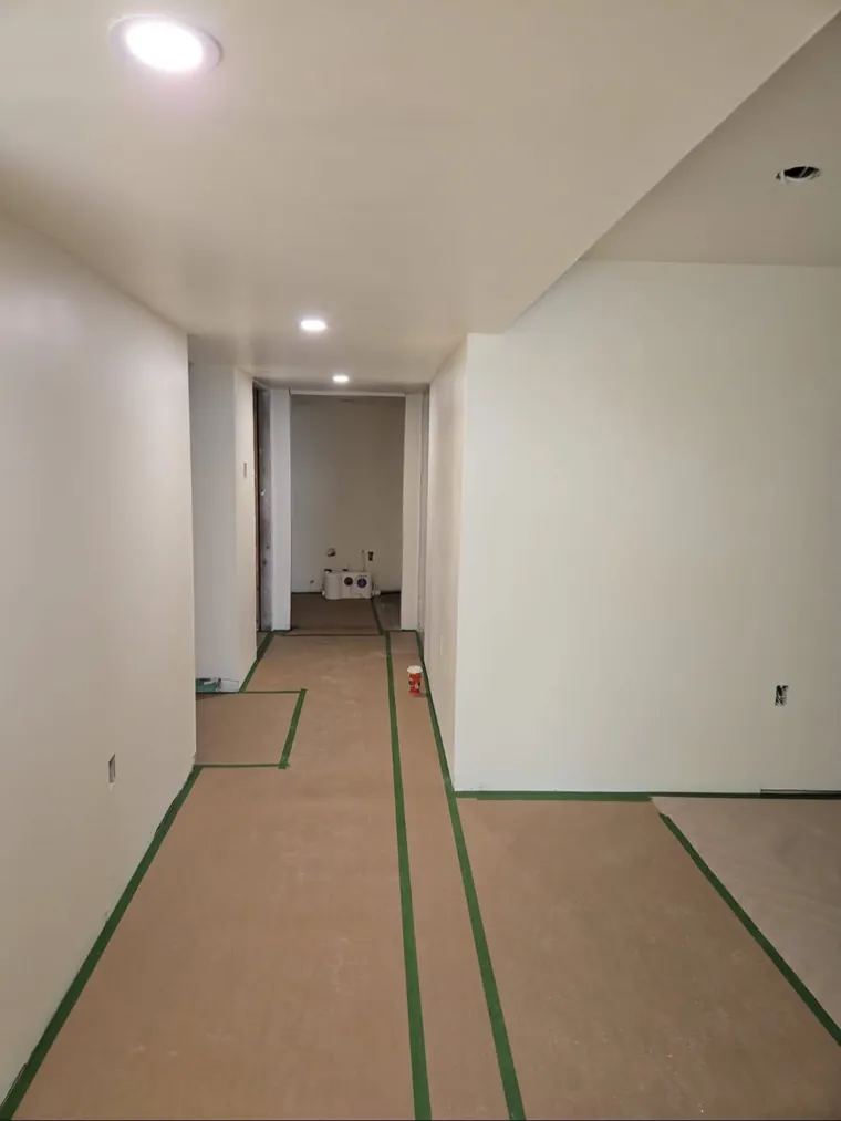 Finished basement renovation with new flooring and trim in Halifax