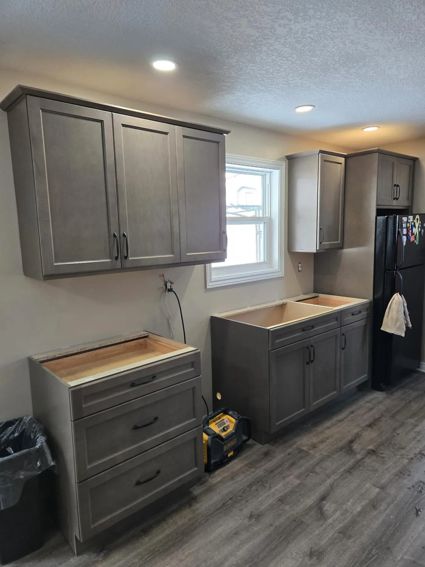 Nova Core Construction crew installing kitchen cabinetry on a Halifax renovation