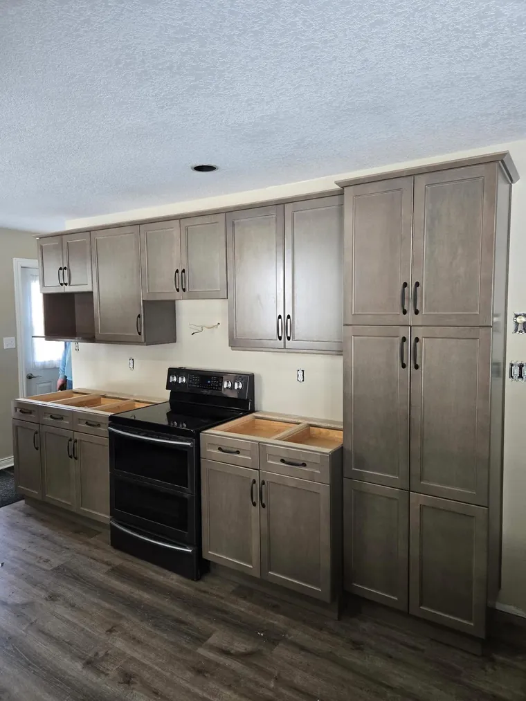 Gray shaker kitchen cabinet installation
