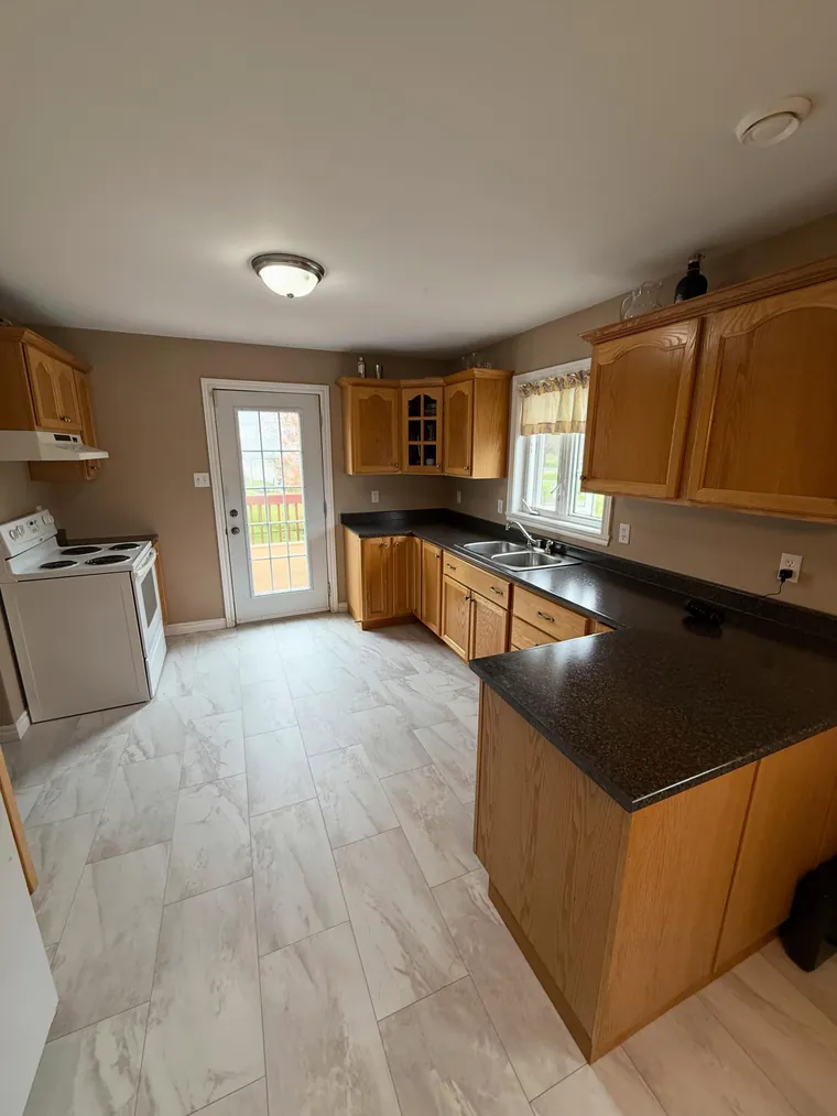 Oak cabinetry and finish carpentry detail in a Bedford kitchen